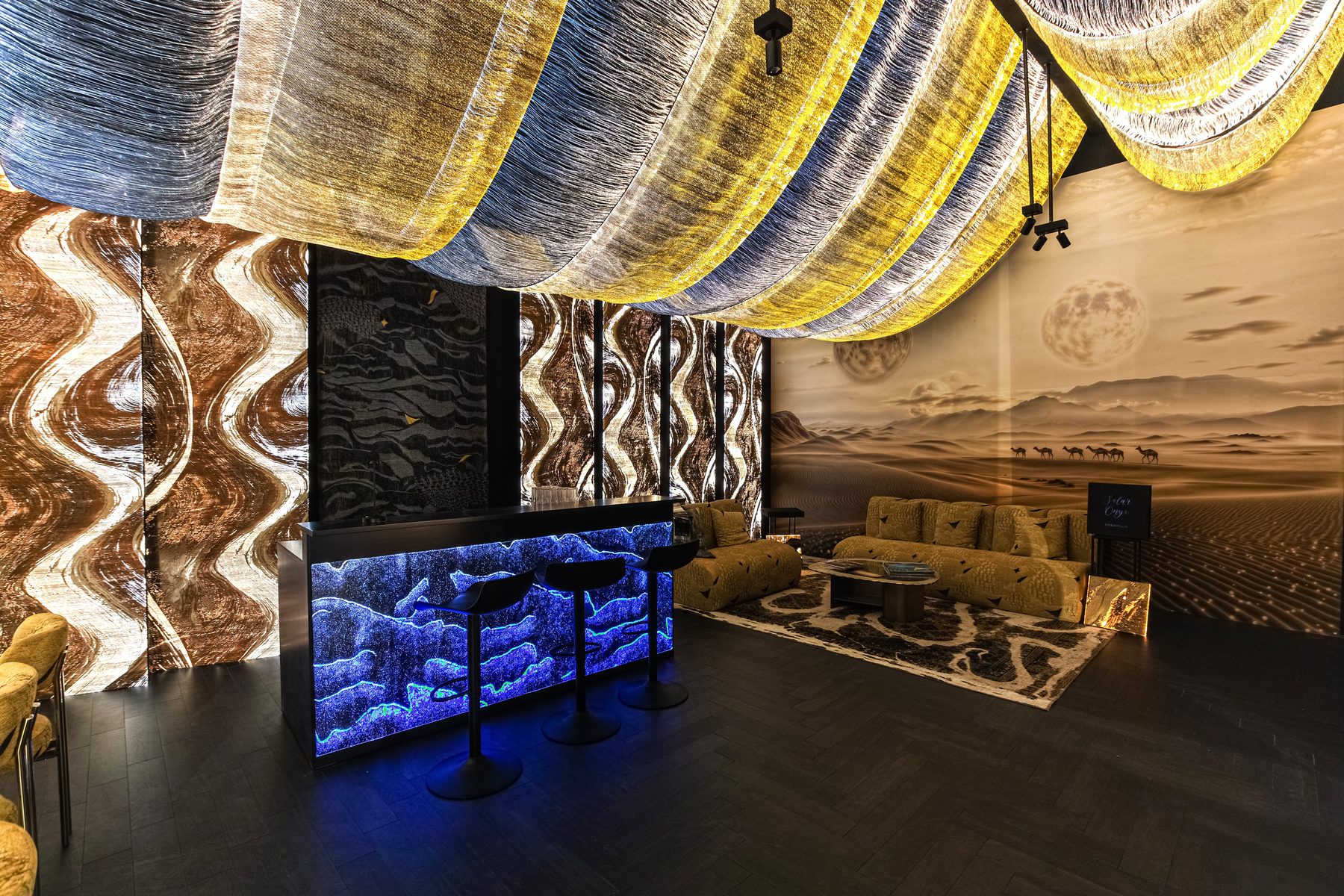 Illuminated furniture upholstered with fiber-optic fabric