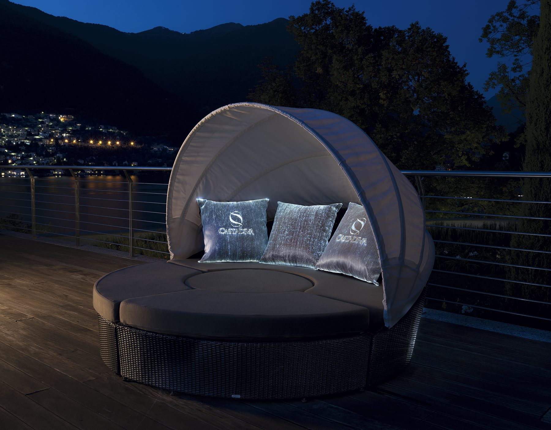 Outdoor daybed with illuminated fiber-optic cushions