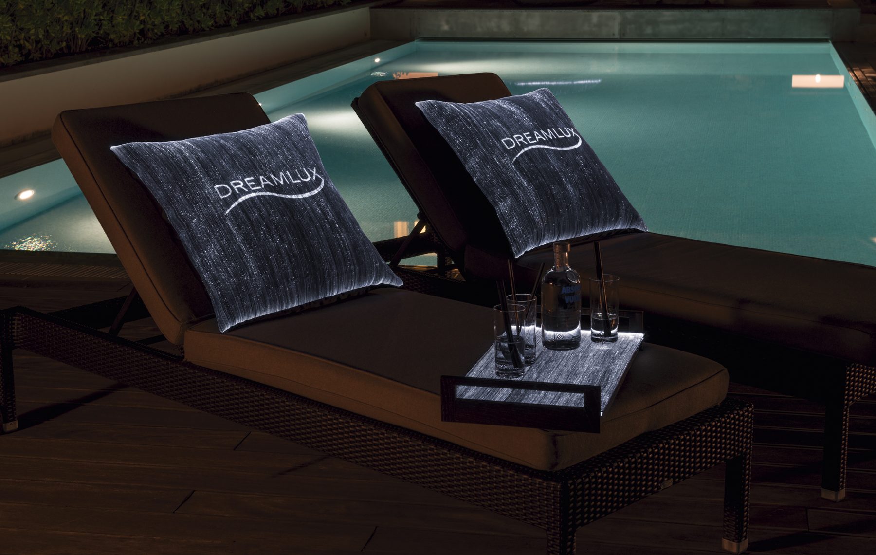 Poolside loungers with illuminated cushions