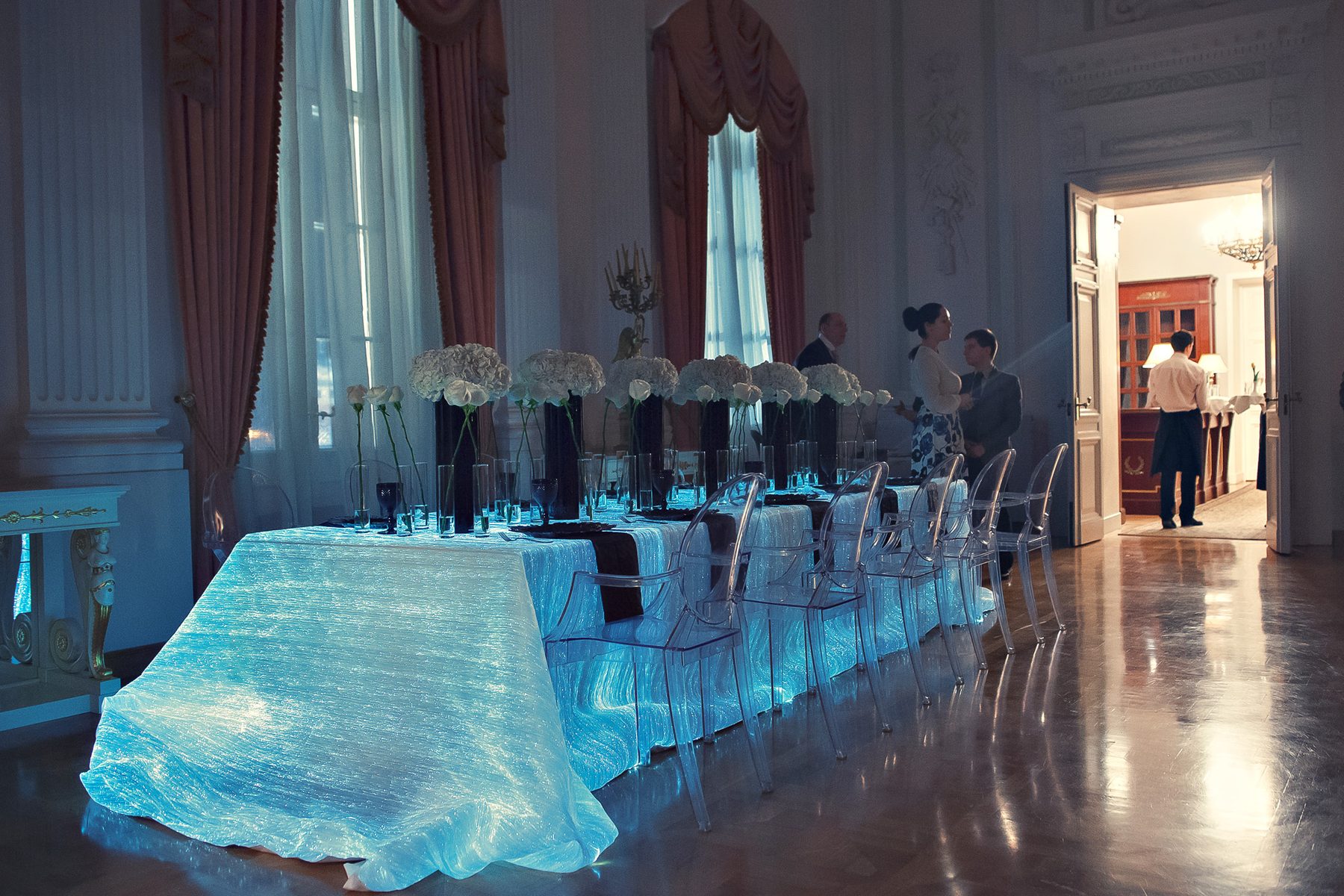 Illuminated tablecloth in a grand hall